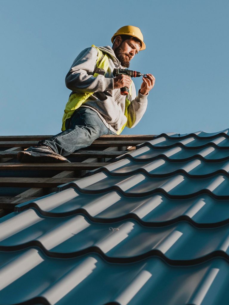 Roofer working in Calow